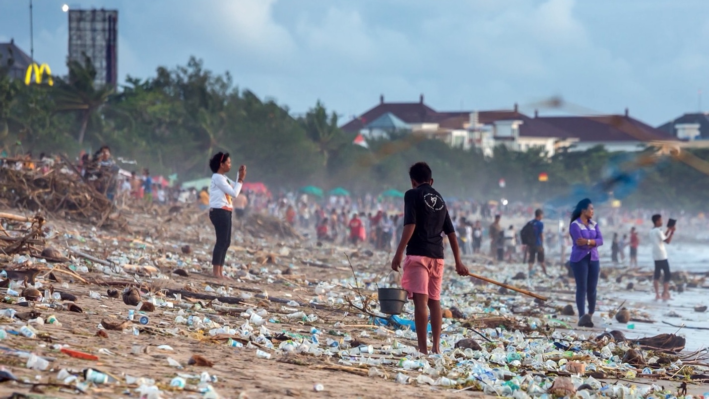 Stock image showing a beach with huge amounts of litter because the tourists and beach visitors left it there